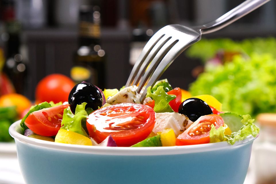 Greek salad with feta cheese and olives, fresh vegetables for a Mediterranean Diet